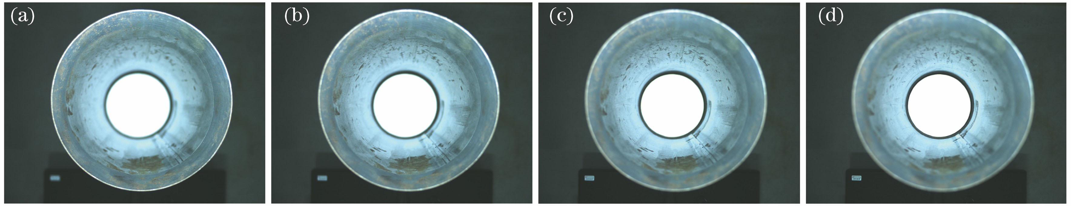 Sequence images of the inner wall of a cylindrical workpiece focused at different positions. (a) Top; (b) upper middle; (c) lower middle; (d) bottom