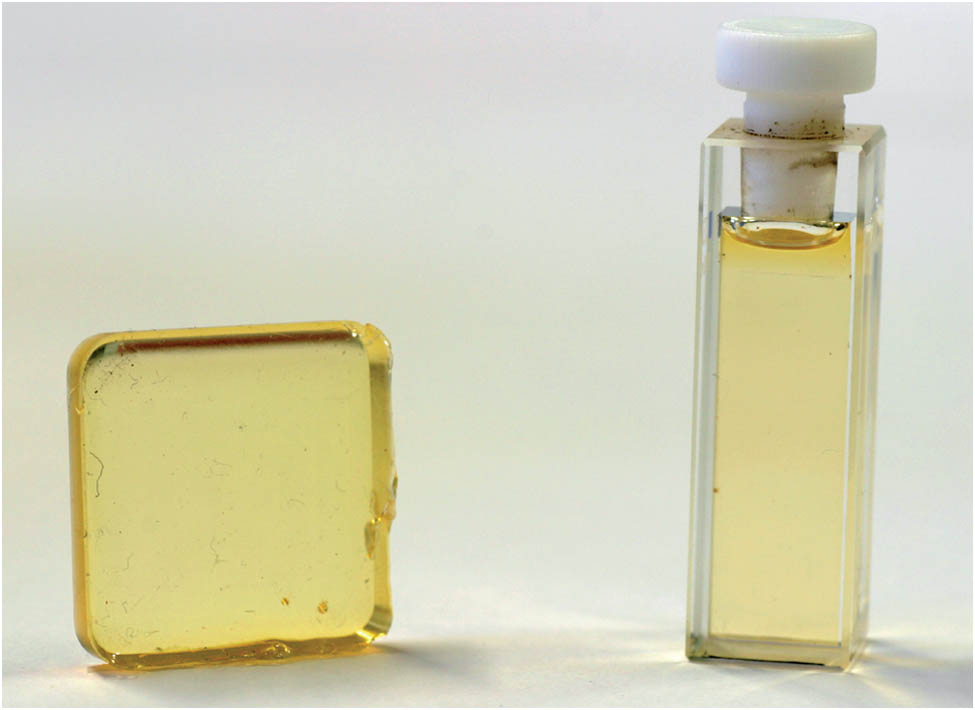 Solid-state sample of OSO embedded in PDMS (left) and the commonly studied solution of OSO in DCM in a cuvette (right).