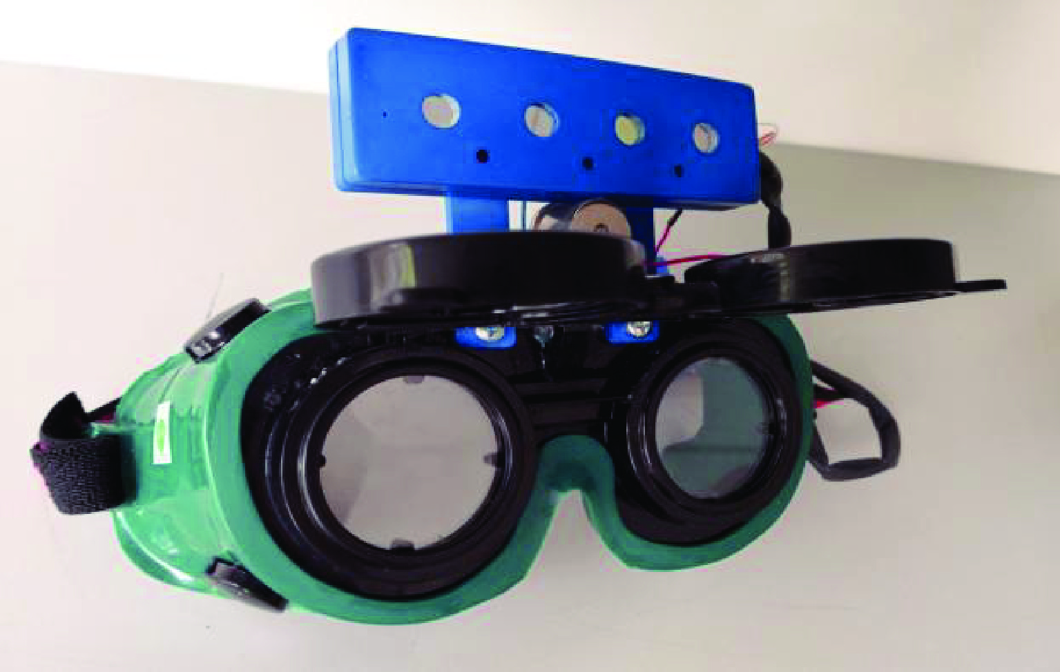 Multifunctional laser protection goggles and laser protection detection and alarm composite device