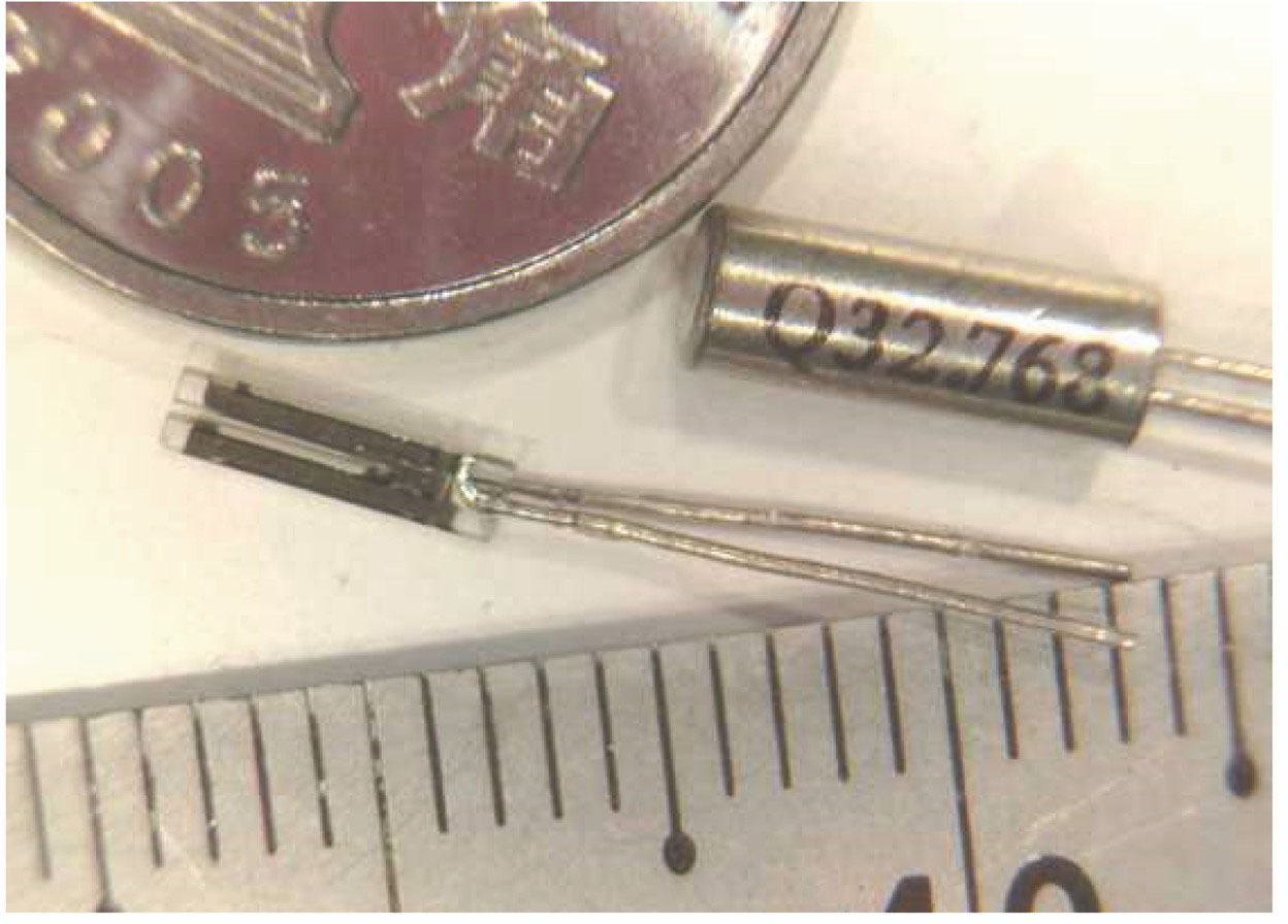 Commercially available standard quartz tuning forks with a resonant frequency of 32 kHz